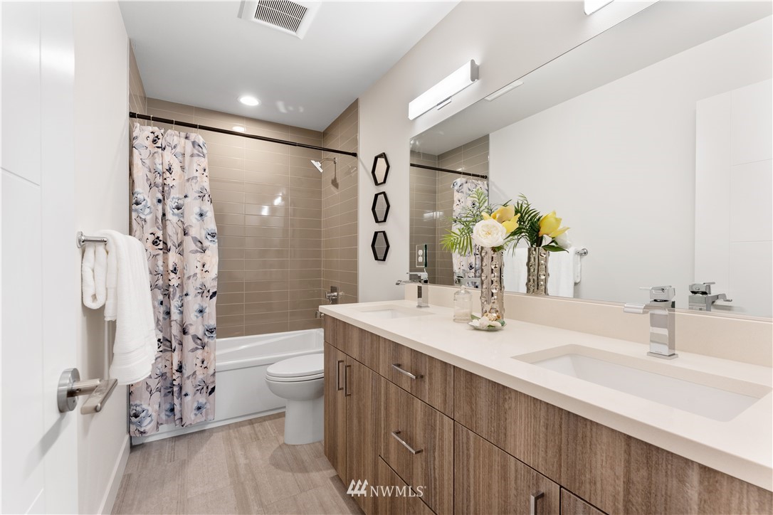 4558 22nd Avenue Southwest Seattle, WA 98106 - Photo 28 of 38 a bathroom with a double vanity sink toilet and shower