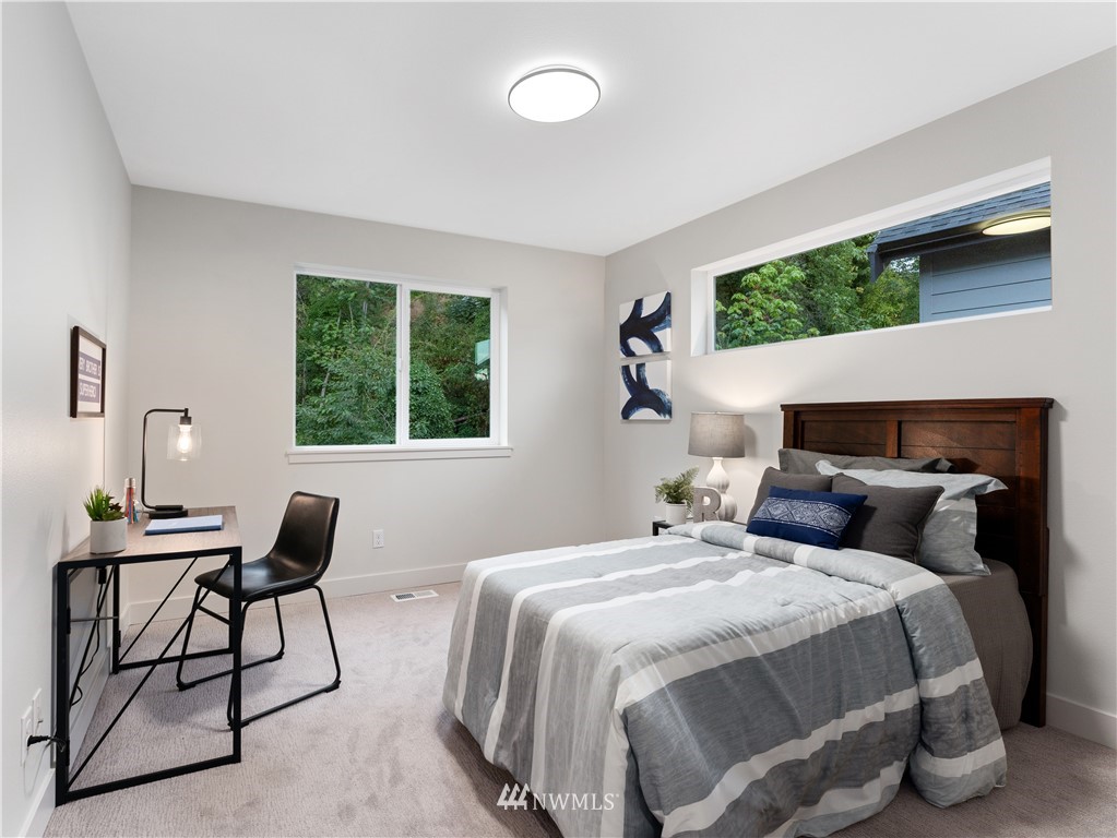 4558 22nd Avenue Southwest Seattle, WA 98106 - Photo 29 of 38 a bedroom with a bed and a window