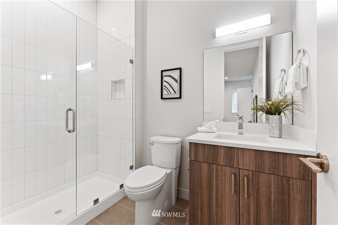 4558 22nd Avenue Southwest Seattle, WA 98106 - Photo 4 of 38 a bathroom with a sink toilet and shower