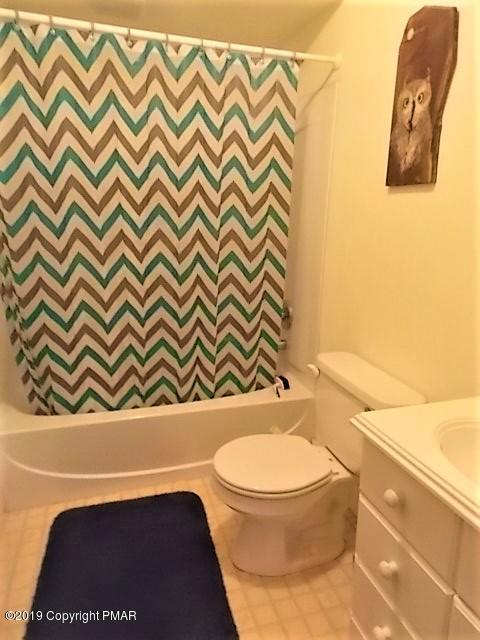 387 Ridge Road Pocono Lake, PA 18347 - Photo 13 of 14 a bathroom with a toilet and a sink