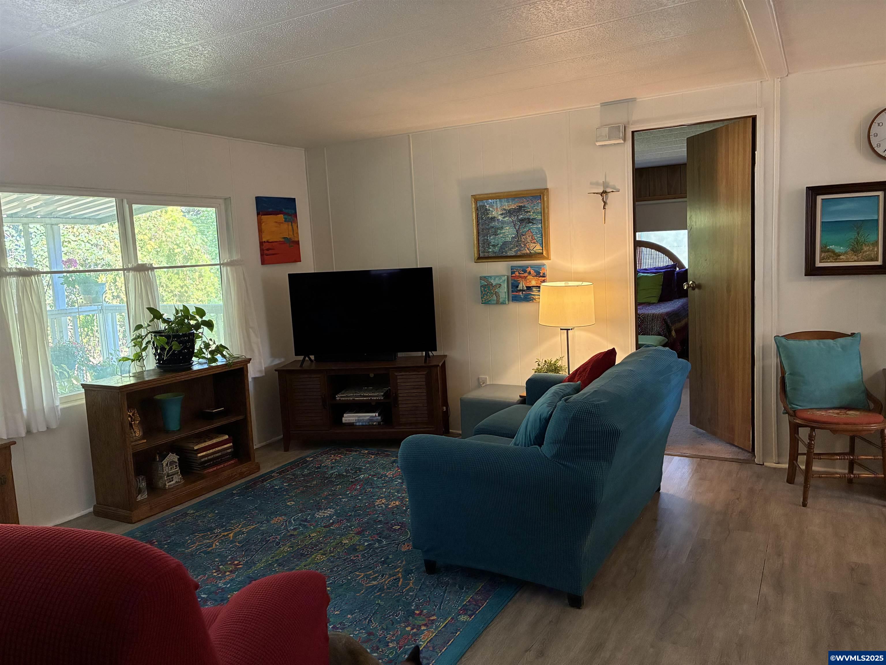 4915 Swegle Road Northeast, Unit 30 Salem, OR 97301 - Photo 14 of 31 a living room with furniture and a flat screen tv