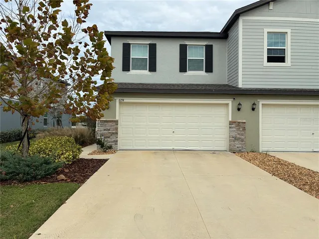 a front view of a house with a garage