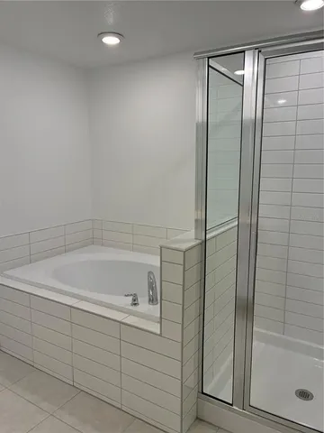 a white toilet sitting next to a white sink