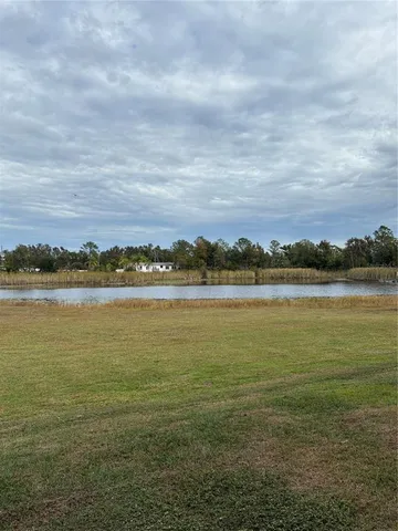 a view of a swimming pool with a lake view