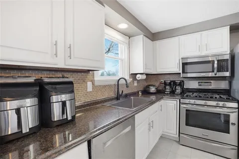a view of a kitchen with cabinets