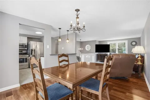 a bathroom with a sink a toilet and shower curtain