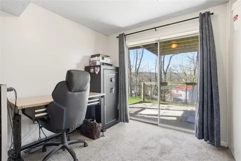 a view of balcony with wooden floor and outdoor seating
