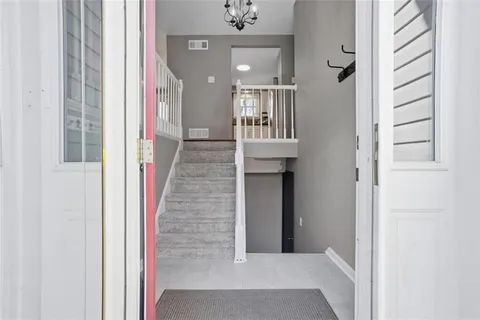 a view of a hallway with closet and entryway