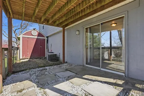 a front view of house with yard and trees