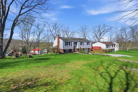 a view of a park with large trees