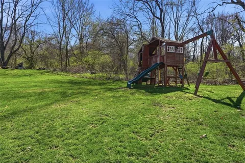 a view of a house with a big yard