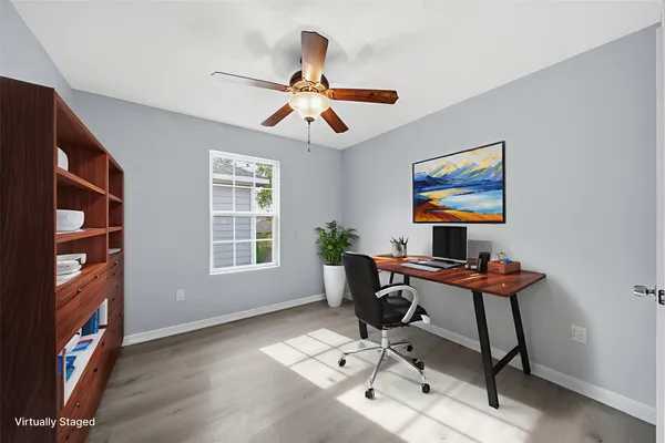 a workspace with furniture and window