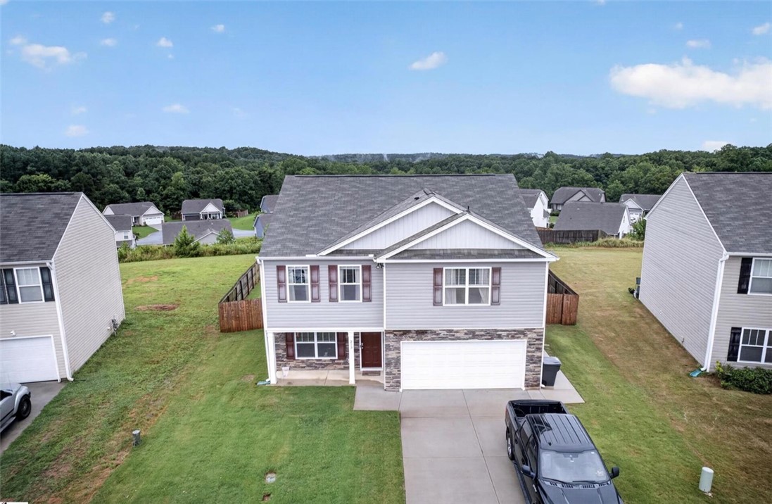 213 Millhone Way Pendleton, SC 29670 - Photo 2 of 25 A classic two-story residence presents a stone and siding facade with a private driveway.