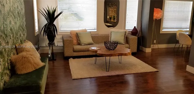 a living room with furniture and a window