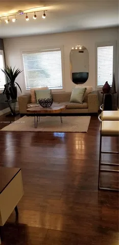 a view of a dining room with furniture and window