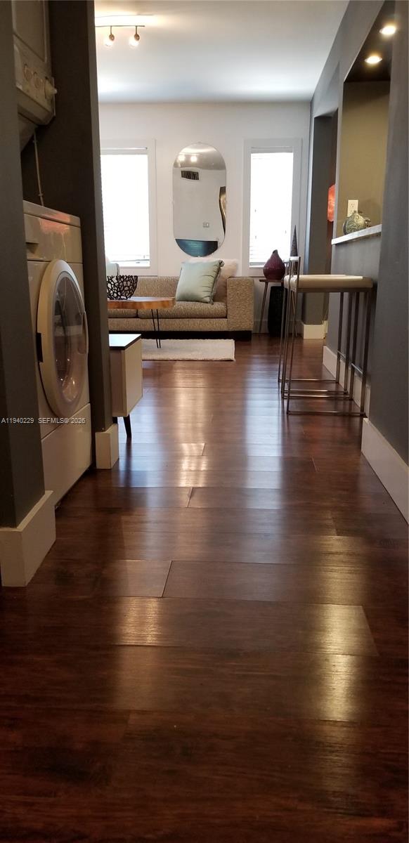 1337 Euclid Avenue, Unit 101 Miami Beach, FL 33139 - Photo 31 of 65 a living room with furniture and a wooden floor