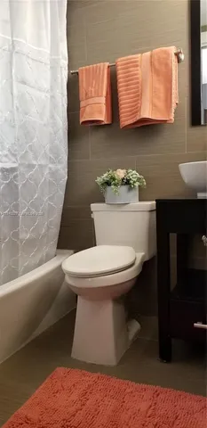 a room with a sink and a mirror