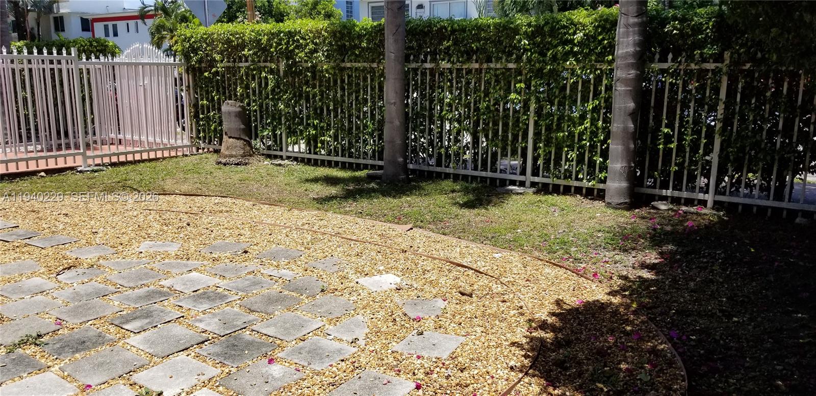 1337 Euclid Avenue, Unit 101 Miami Beach, FL 33139 - Photo 59 of 65 a view of a backyard with pathway