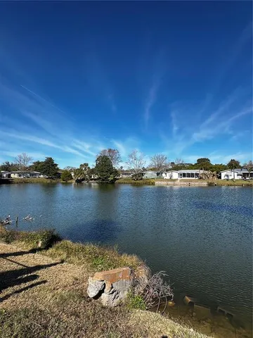 a view of lake from next to a yard
