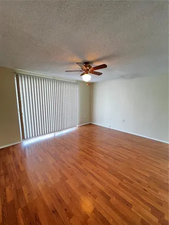 a view of a livingroom with wooden floor