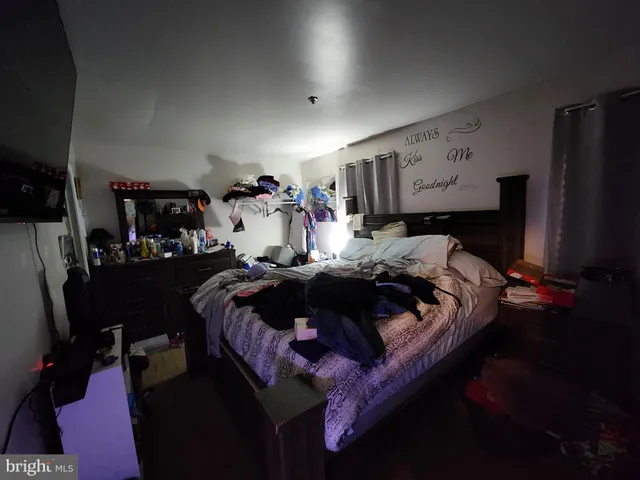 a bedroom with a bed and a closet