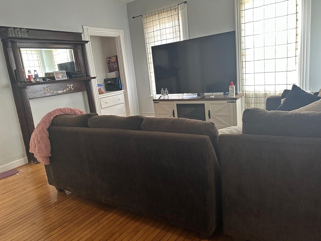 82 Fox Street Worcester, MA 01604 - Photo 16 of 38 a living room with furniture and a flat screen tv