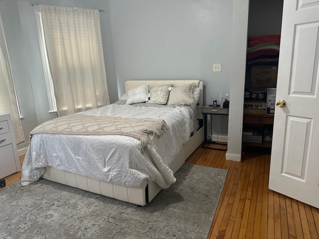 82 Fox Street Worcester, MA 01604 - Photo 19 of 38 a bedroom with a bed and a table