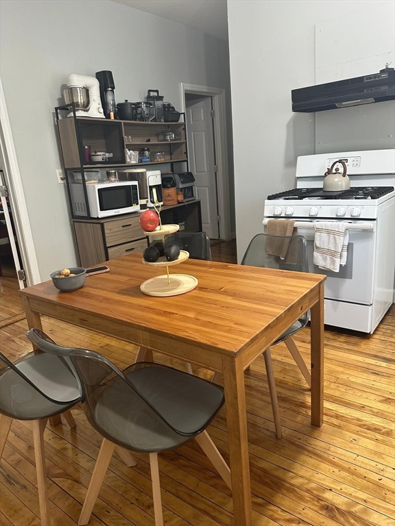 82 Fox Street Worcester, MA 01604 - Photo 26 of 38 a dining table with chairs and wooden floor