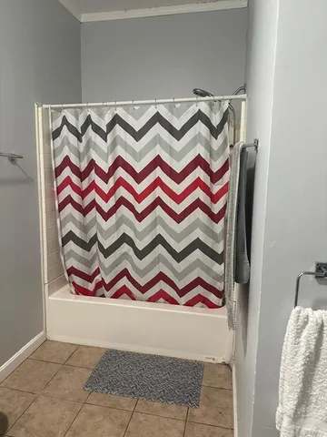 a area with paintings on wall and a shower