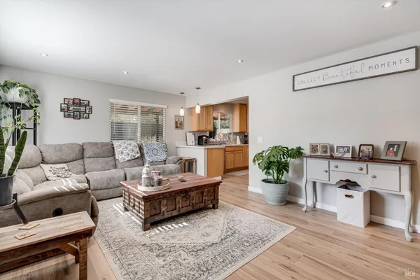 a living room with furniture fireplace and a flat screen tv