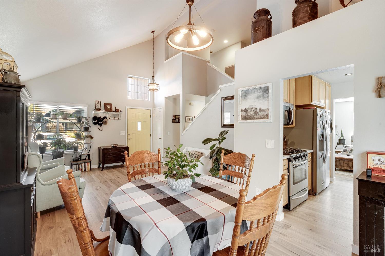 532 Walten Way Windsor, CA 95492 - Photo 31 of 65 a living room with furniture a chandelier and kitchen view