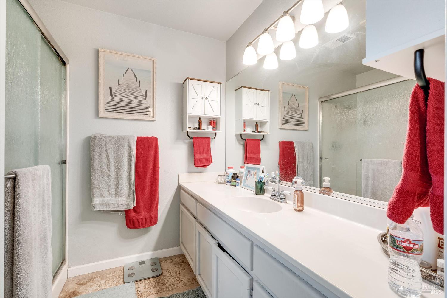 532 Walten Way Windsor, CA 95492 - Photo 38 of 65 a bathroom with a sink vanity and a mirror
