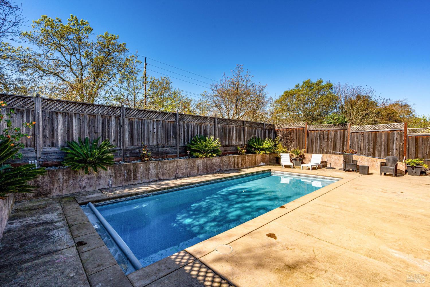 532 Walten Way Windsor, CA 95492 - Photo 59 of 65 a swimming pool with outdoor seating and yard