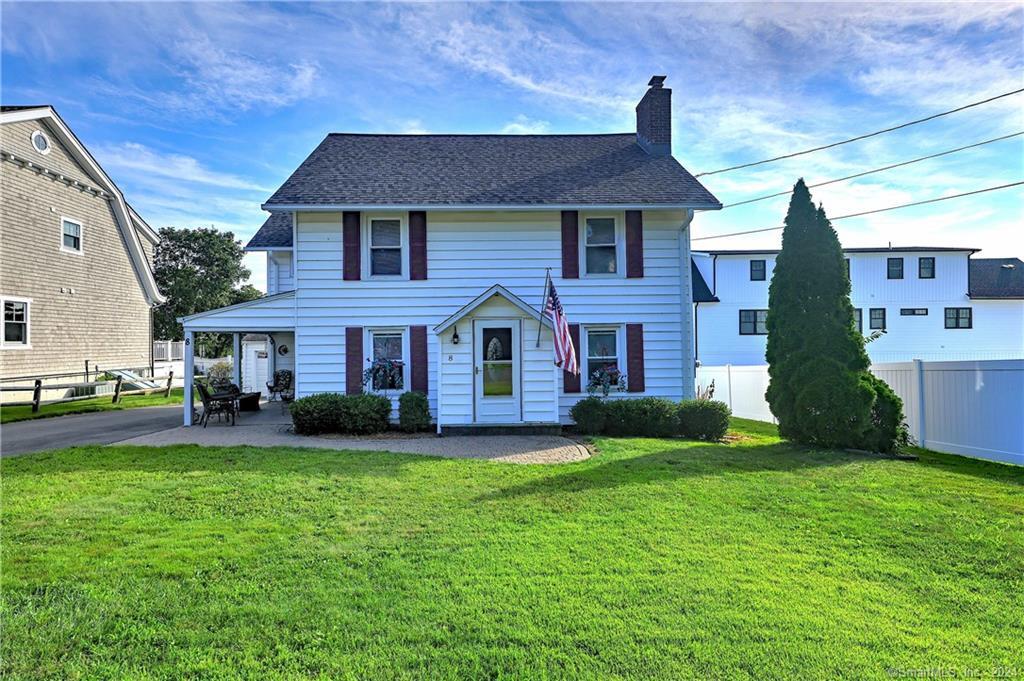 8 Crest Place Milford, CT 06460 - Photo 1 of 1 a front view of brick house with a yard