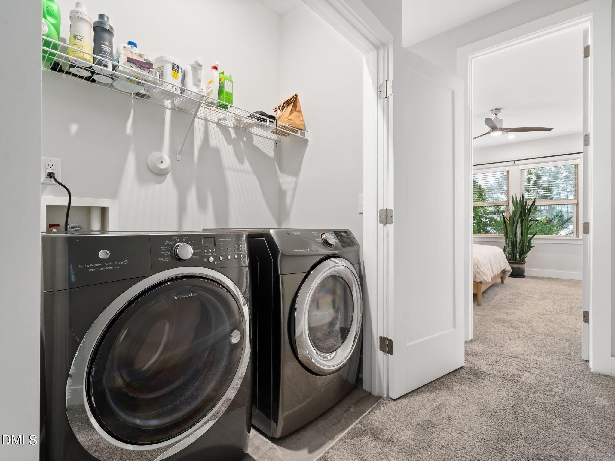 916 Waterside View Drive Raleigh, NC 27606 - Photo 16 of 22 a view of a storage & utility room with a washer dryer