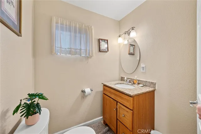 a bedroom with furniture and a flat screen tv