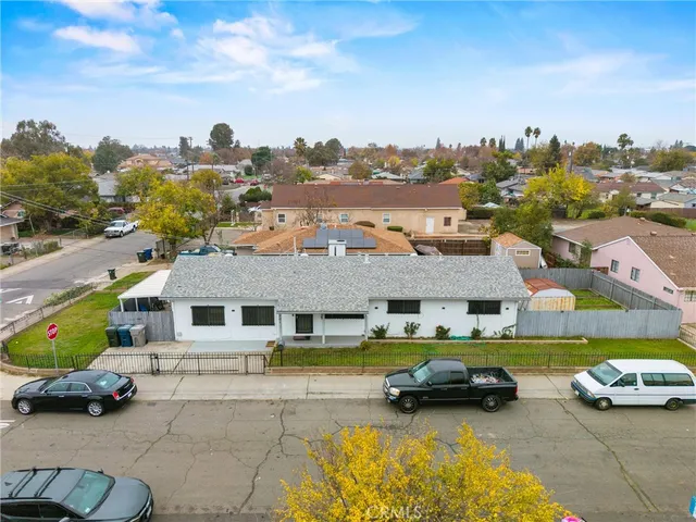 an aerial view of residential houses with outdoor space