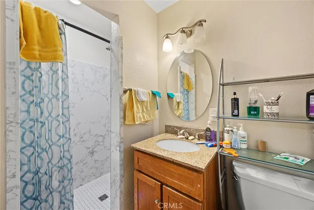 a bedroom with bed and a chandelier