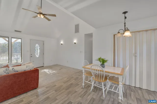a view of a livingroom with furniture and wooden floor