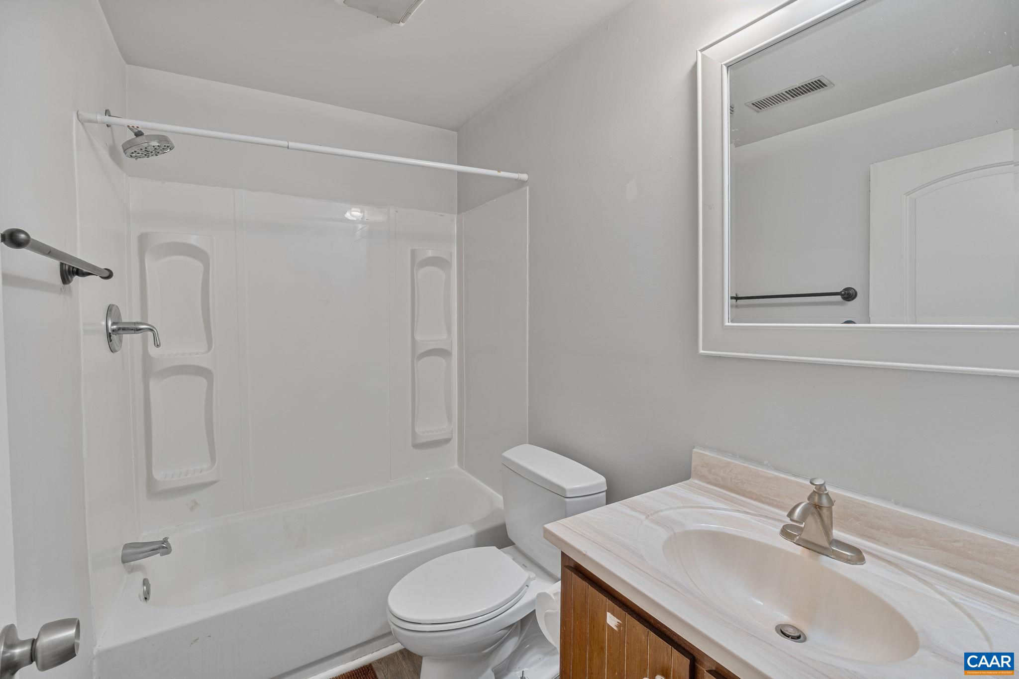 874 James River Road Scottsville, VA 24590 - Photo 18 of 43 a bathroom with a sink toilet and shower