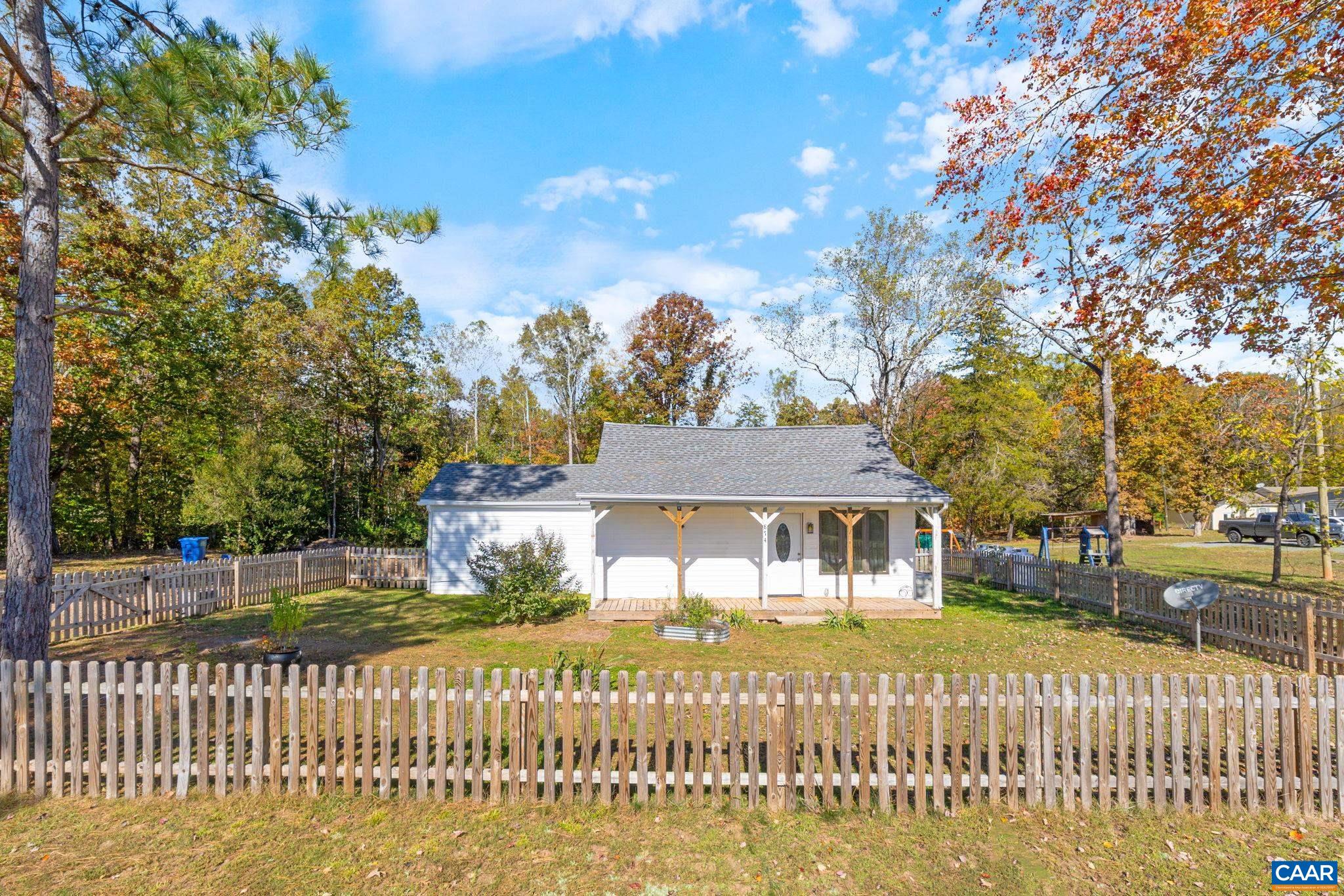 874 James River Road Scottsville, VA 24590 - Photo 2 of 43 a front view of a house with a garden