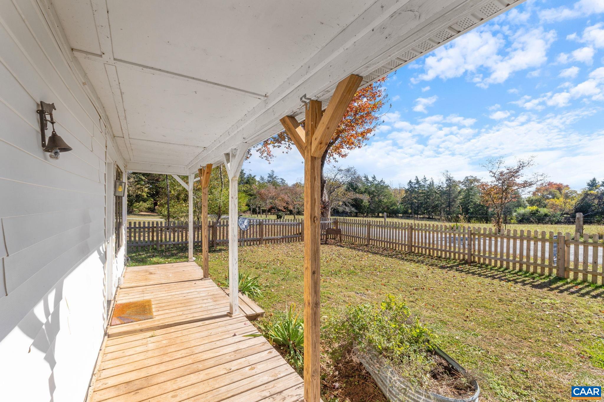 874 James River Road Scottsville, VA 24590 - Photo 28 of 43 a view of balcony with wooden floor and fence