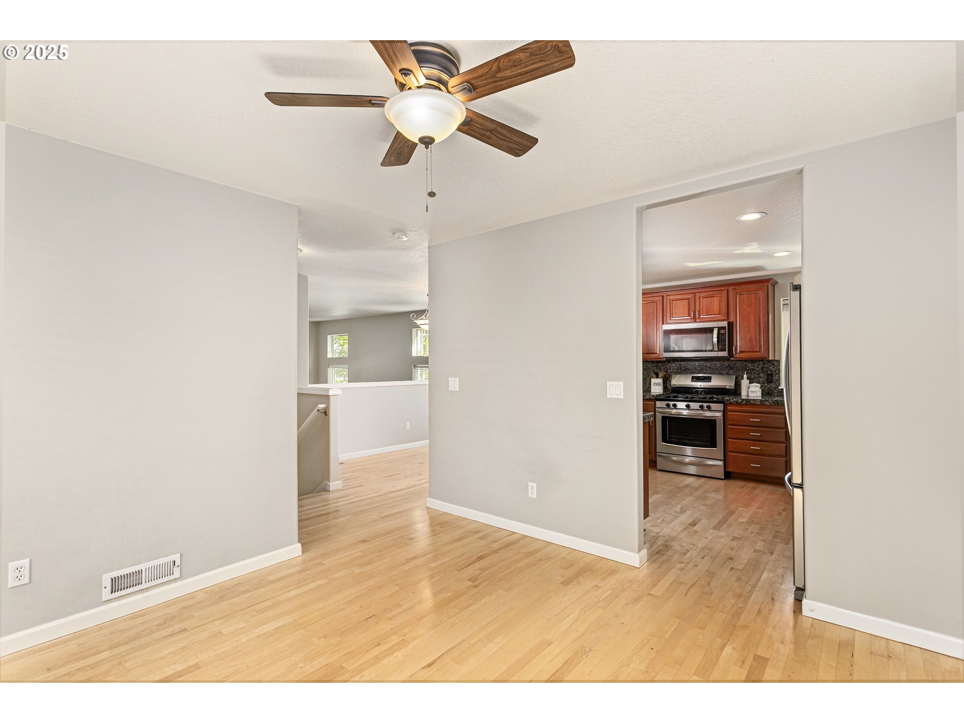 3200 Wild Rose Loop West Linn, OR 97068 - Photo 24 of 47 a view of a living room and a ceiling fan