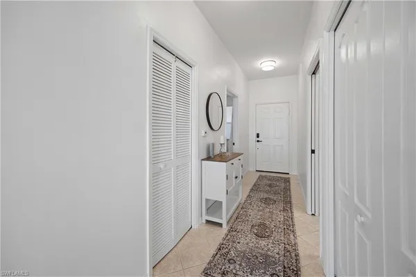 a bathroom with a granite countertop sink a toilet and a shower