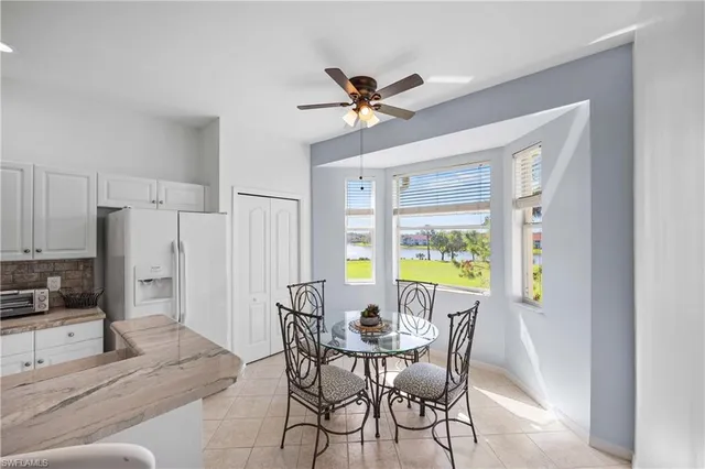 a view of a dining room with furniture window and outside view