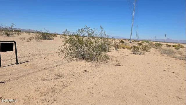 a view of ocean beach and mountain