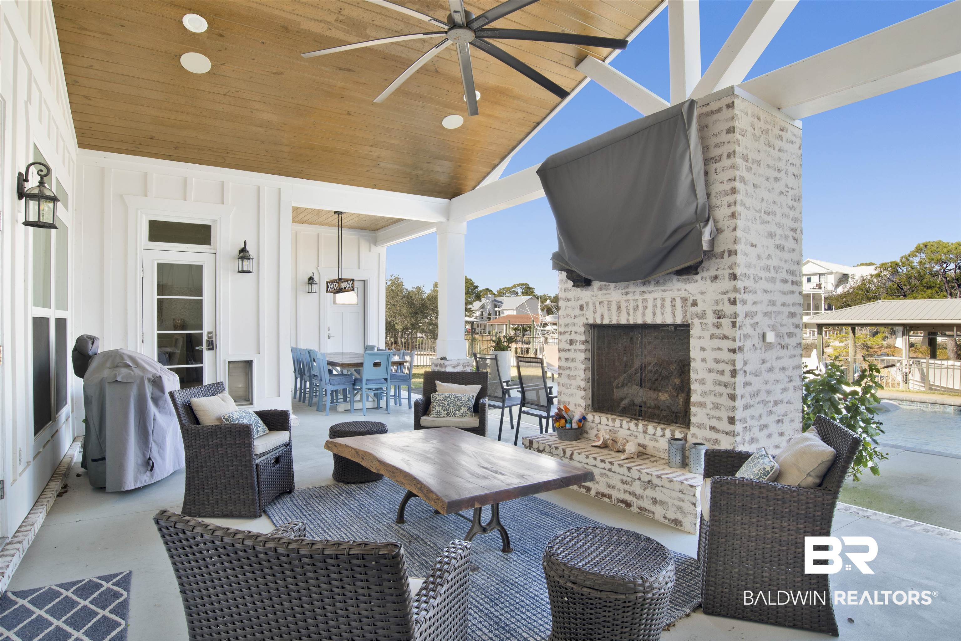 32937 River Road Orange Beach, AL 36561 - Photo 32 of 42 View of patio featuring an outdoor brick fireplace, ceiling fan, and a grill