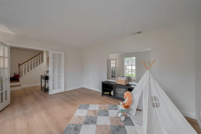 a view of livingroom with furniture and stairs