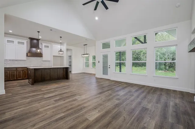 a view of kitchen with furniture and wooden floor