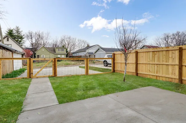 a view of backyard with green space